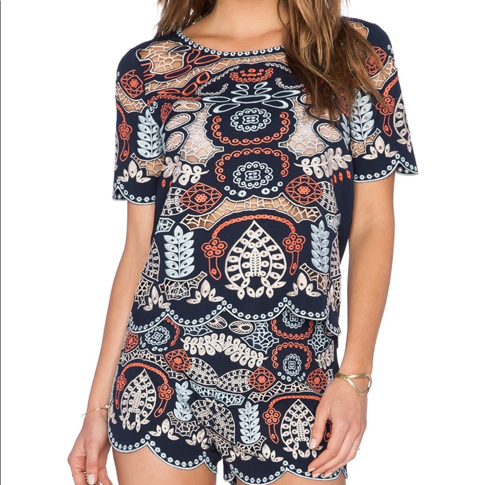 Small Joa color shirt with cut outs!